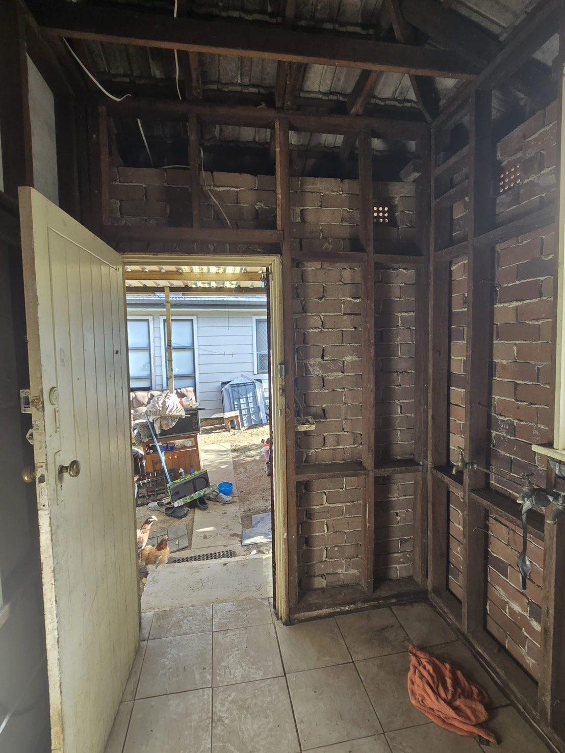 Stripped back walls and doorway after asbestos removal