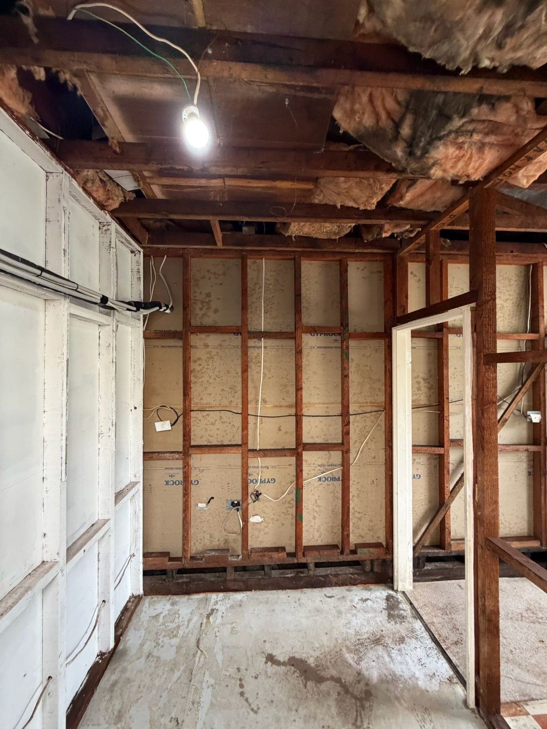 Timber framing with brick wall and hanging work light